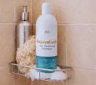 RejuvaLush bottle in shower